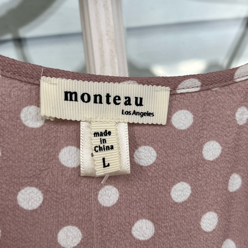 Pink spaghetti strap top with white polka dots